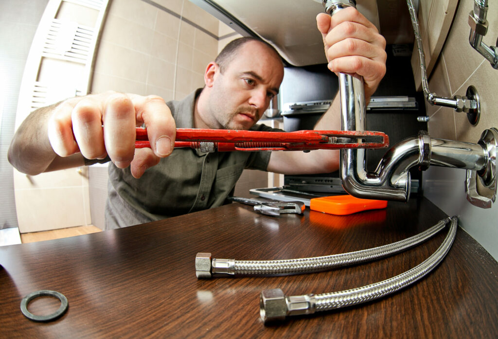 Portrait of caucasian plumber at work